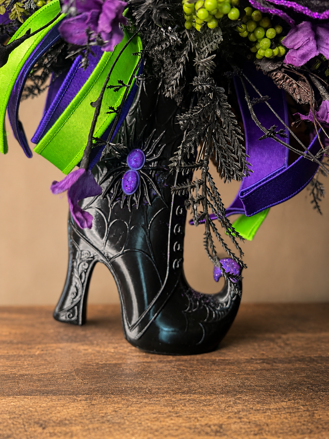 14. Witchy Boot Halloween Floral Arrangement – Purple, Green & Black