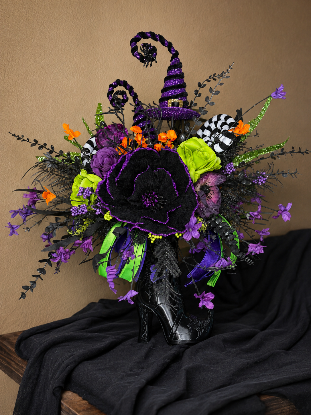 14. Witchy Boot Halloween Floral Arrangement – Purple, Green & Black