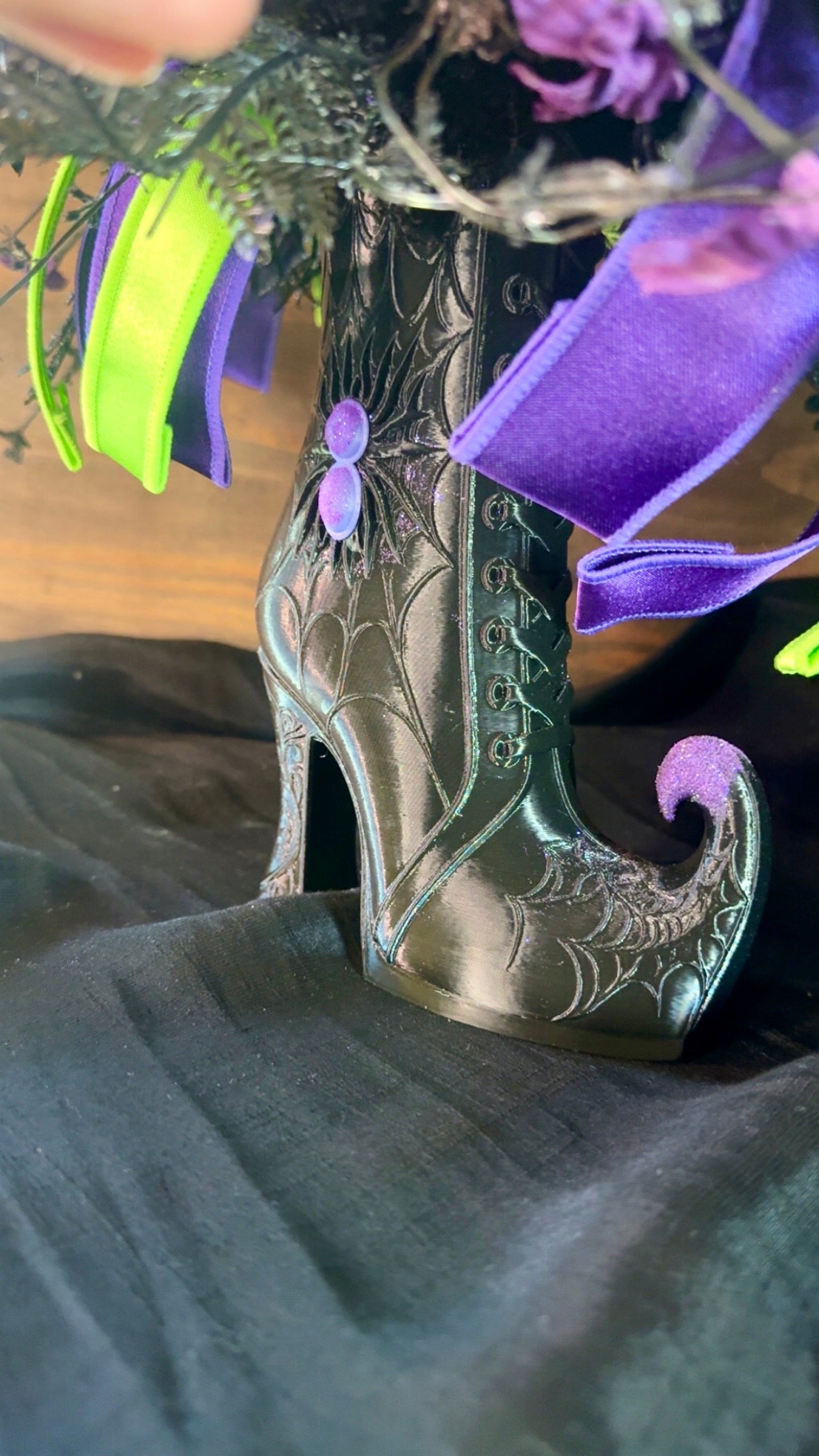 14. Witchy Boot Halloween Floral Arrangement – Purple, Green & Black